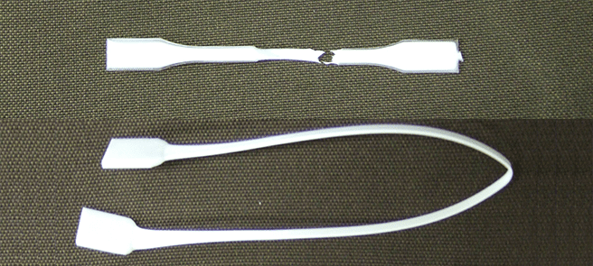 Samples after tensile testing of PE/PET alloys.